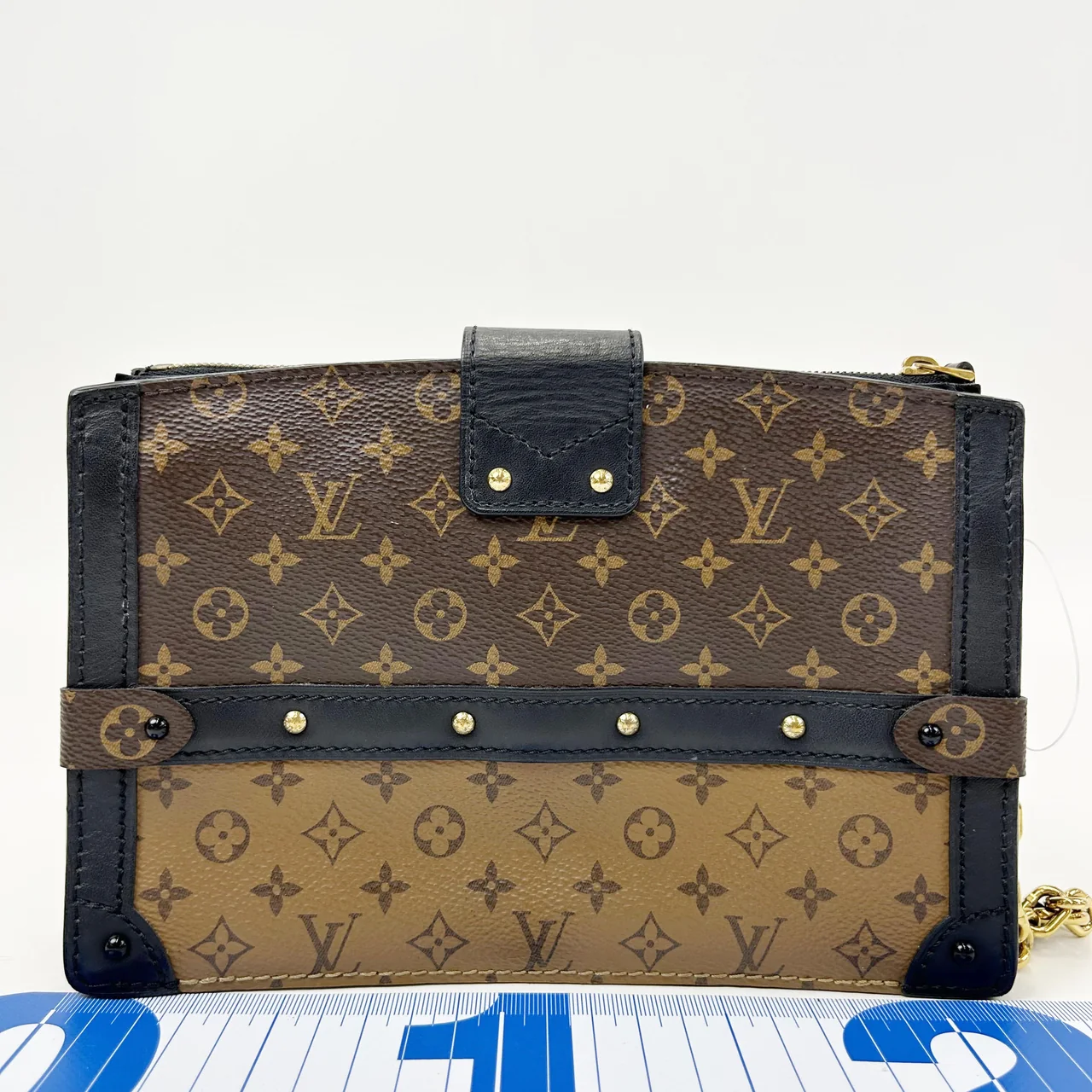 LV MONOGRAM REVERSE TRUNK CLUTCH hover