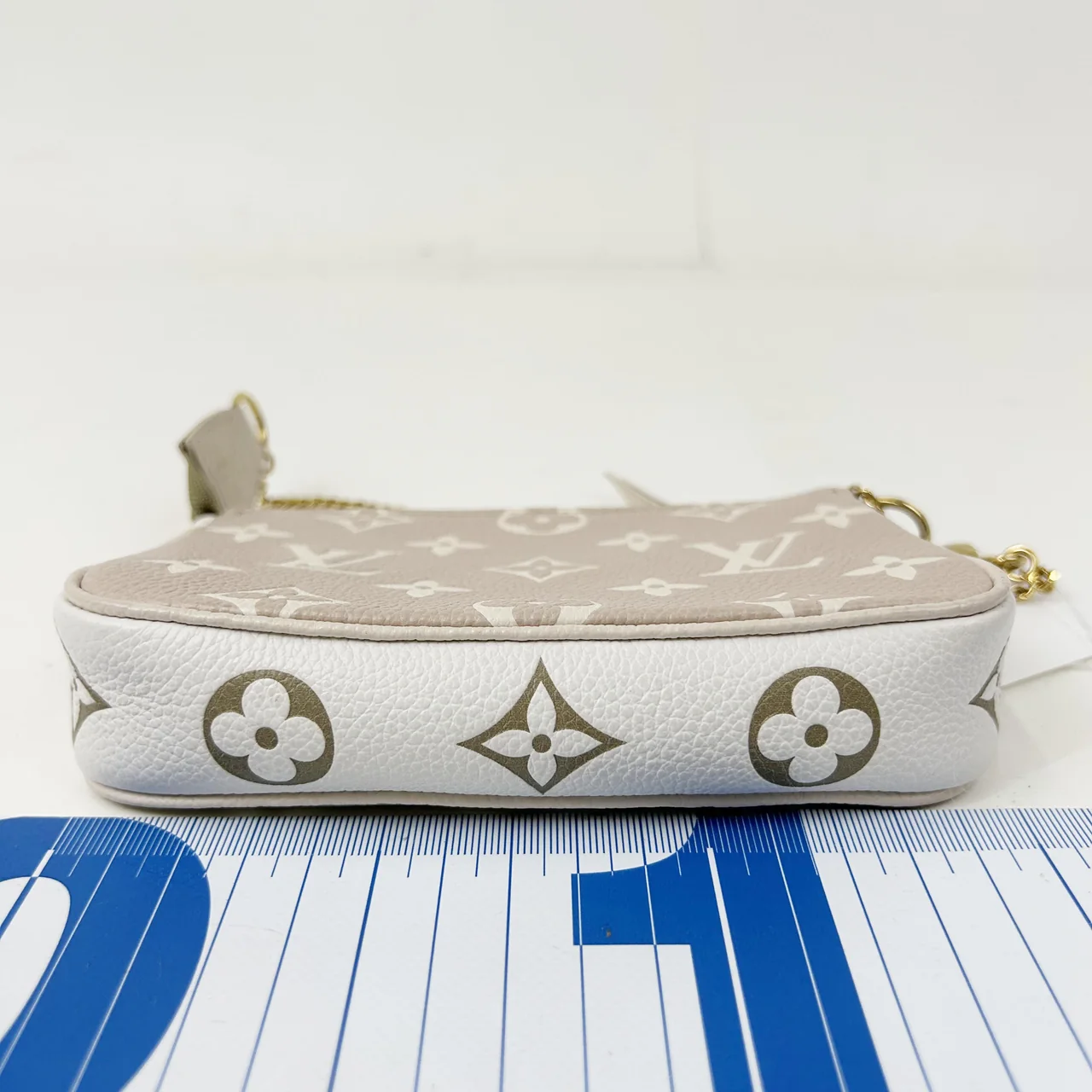 LV MONOGRAM EMPRIENTE MINI POCHETTE ACCESSORY view 3