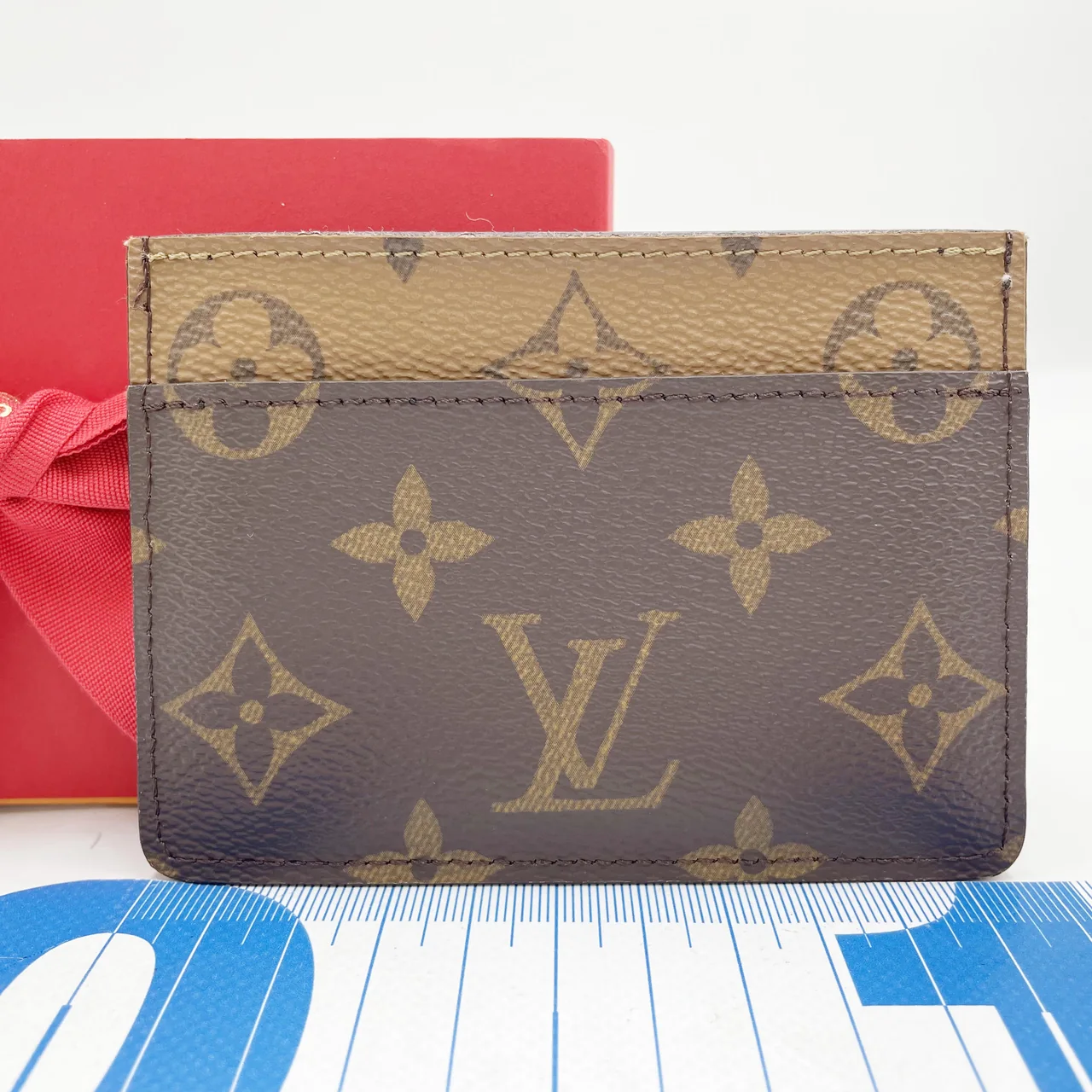 LV MONOGRAM REVERSE PORTE CARTES DAUPHINE hover